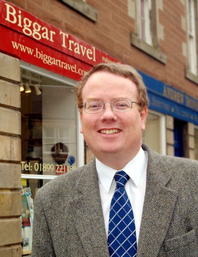 David outside Biggar Travel shop - copyright of Lindsay Addison